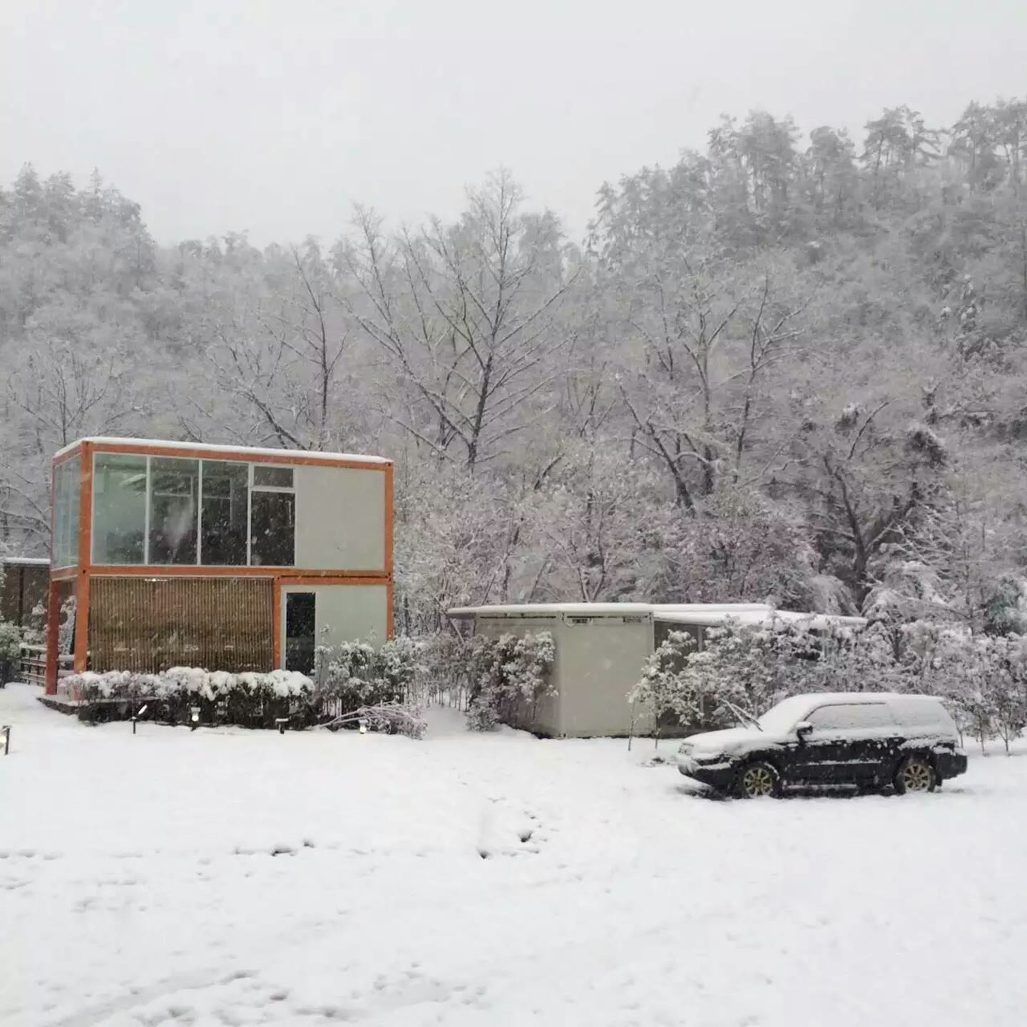 Completed container clubhouse in a snowy setting