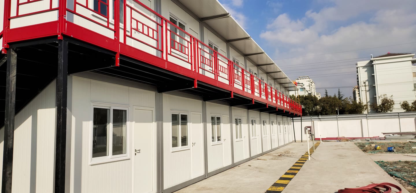 Completed two-storey modular workforce accommodation building with red gallery railings