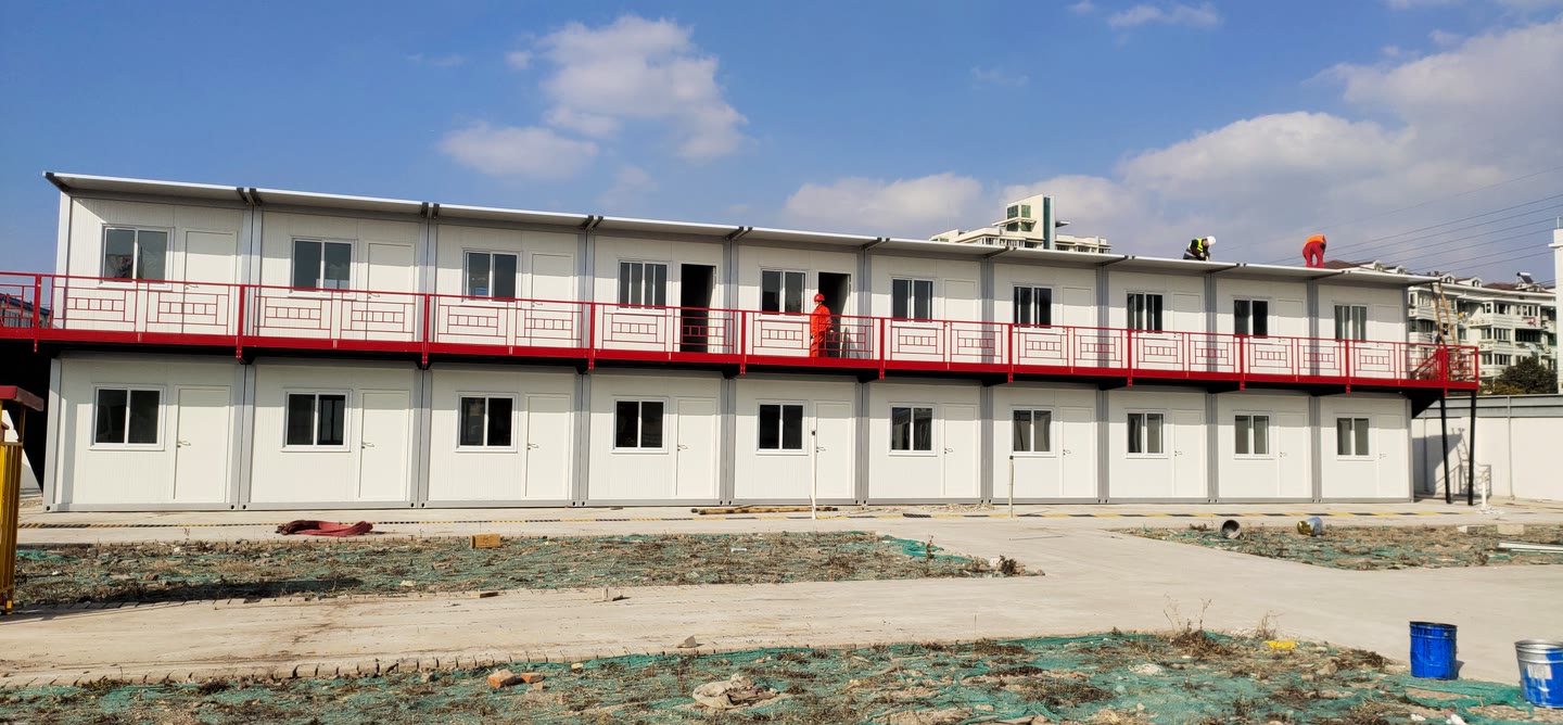 Front elevation of a two-storey modular accommodation building during final site work