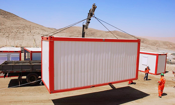 A Star House flat-pack container module being lifted at a project site